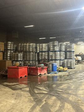 Scrap Metal Recycling Facility with Stacked Metal and Containers